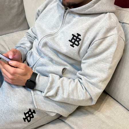 Bee Inspired Guedes Zip Hoodie in Grey Marl, zip hoodie with a clean embroidered BI monogram graphic, styled lifestyle shot