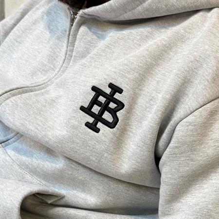 Bee Inspired Guedes Zip Hoodie in Grey Marl, zip hoodie with a clean embroidered BI monogram graphic, styled lifestyle shot