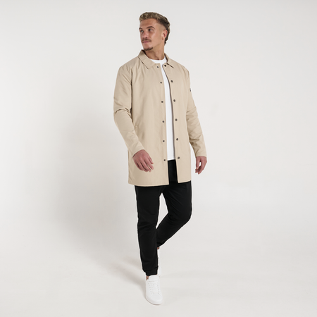 Bee Inspired Hanley Trench Coat in Sand, slim fit trench coat with a collared neck and branded snap fastenings, close-up