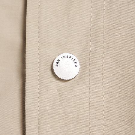 Bee Inspired Hanley Trench Coat in Sand, slim fit trench coat with a collared neck and branded snap fastenings