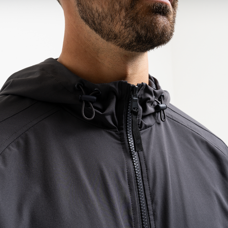 Bee Inspired Juranovic Jacket in Charcoal, lightweight jacket with adjustable hood and neckline toggles, close-up