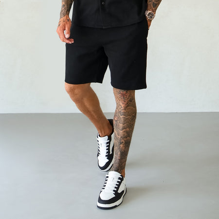 Bee Inspired Kawashima Short in black, regular fit with a linear logo above the back pocket