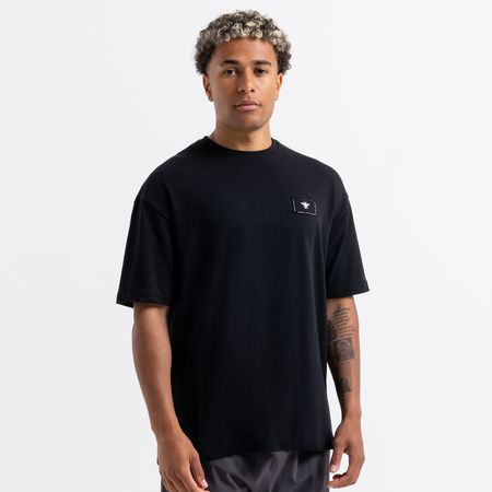 Legacy Logo T-Shirt in black with embroidered fabric on the chest and back