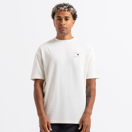 Bee Inspired Legacy Logo T-Shirt in Off-White, tee featuring the Legacy design and signature Bee logo, styled shot