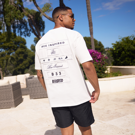 Bee Inspired Legacy Logo T-Shirt in Off-White, tee featuring the Legacy design and signature Bee logo, close-up