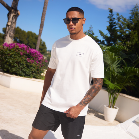 Bee Inspired Legacy Logo T-Shirt in Off-White, tee featuring the Legacy design and signature Bee logo, styled shot