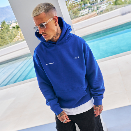 Bee Inspired Mata Hoodie in Blue, oversized hoodie with a bold rear graphic print, close-up
