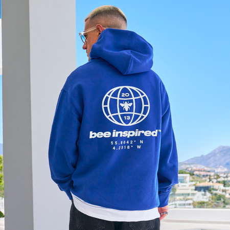 Bee Inspired Mata Hoodie in Blue, oversized hoodie with a bold rear graphic print, front view