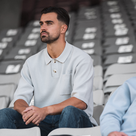 Bee Inspired Nazario Polo in Light Grey, premium knit polo with subtle embroidered detailing, styled lifestyle shot