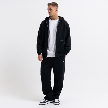 Bee Inspired Initial Jogpant in Black, relaxed fit jogpants, part of the B33 Foundations range, styled shot