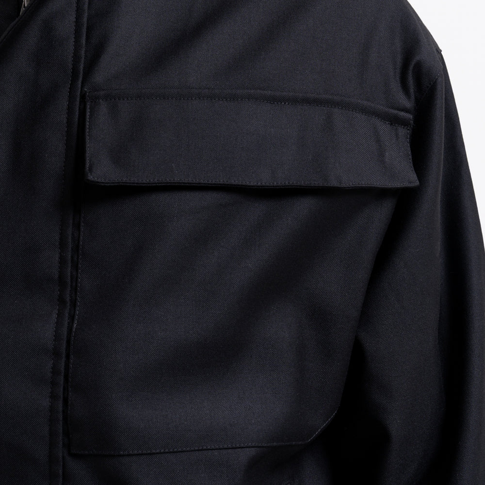 Onana Jacket in black, focusing on tonal Bee branding