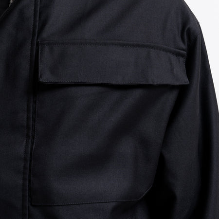 Onana Jacket in black, focusing on tonal Bee branding