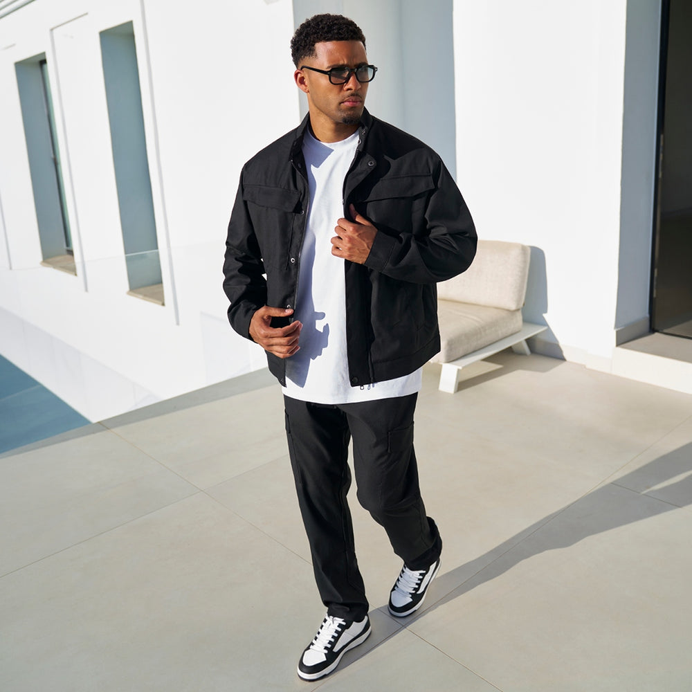 Full length view of the Onana Jacket in black
