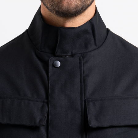 Bee Inspired Onana Jacket in Black, utility-style jacket with tonal Bee branding and chest pockets, close-up