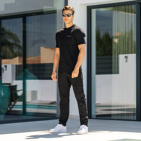 Parkes Cargo Pant in black, focusing on an elasticated drawcord waistband