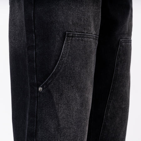 Pirlo Relaxed Jeans in black, focusing on branded rivets