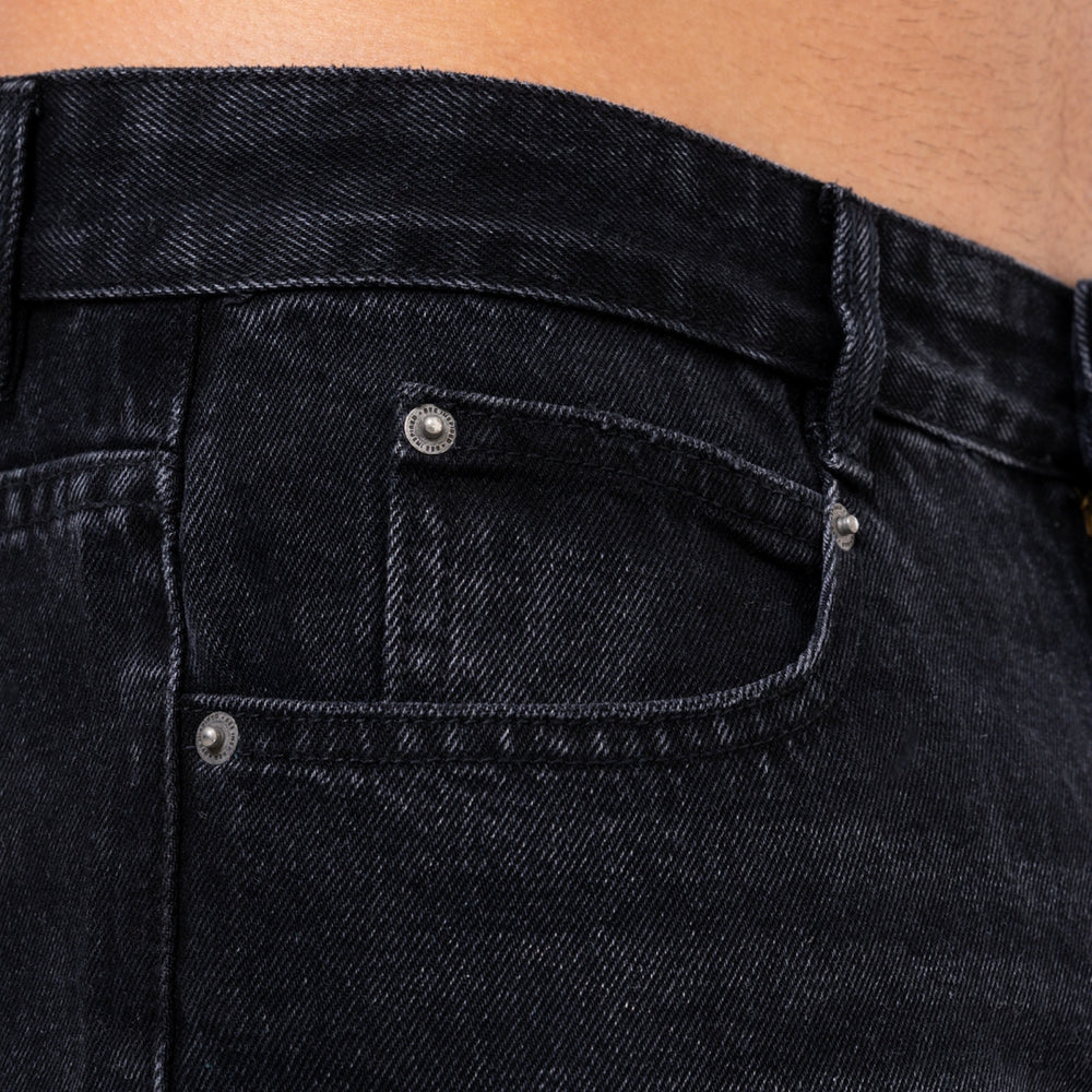 Pirlo Relaxed Jeans in black, focusing on a back waistband patch
