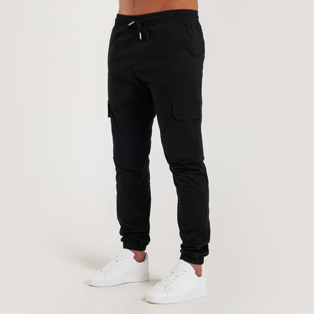 Rivero Cargo Pants in black with stretch ankle cuffs
