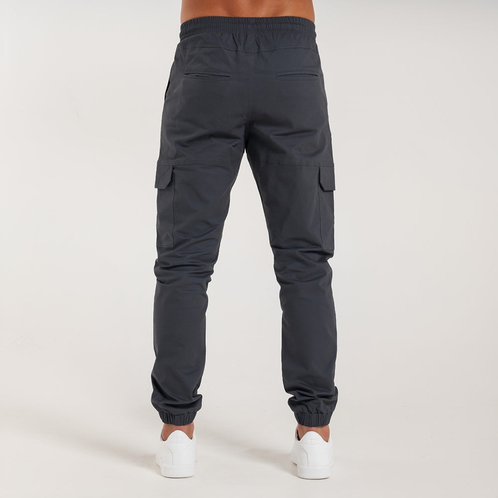 Rivero Cargo Pants in charcoal with a metal branded pocket label