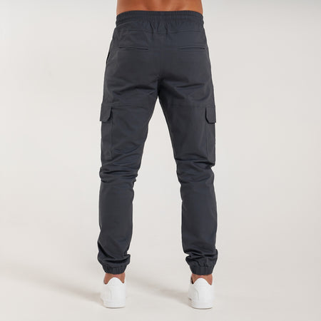 Rivero Cargo Pants in charcoal with a metal branded pocket label
