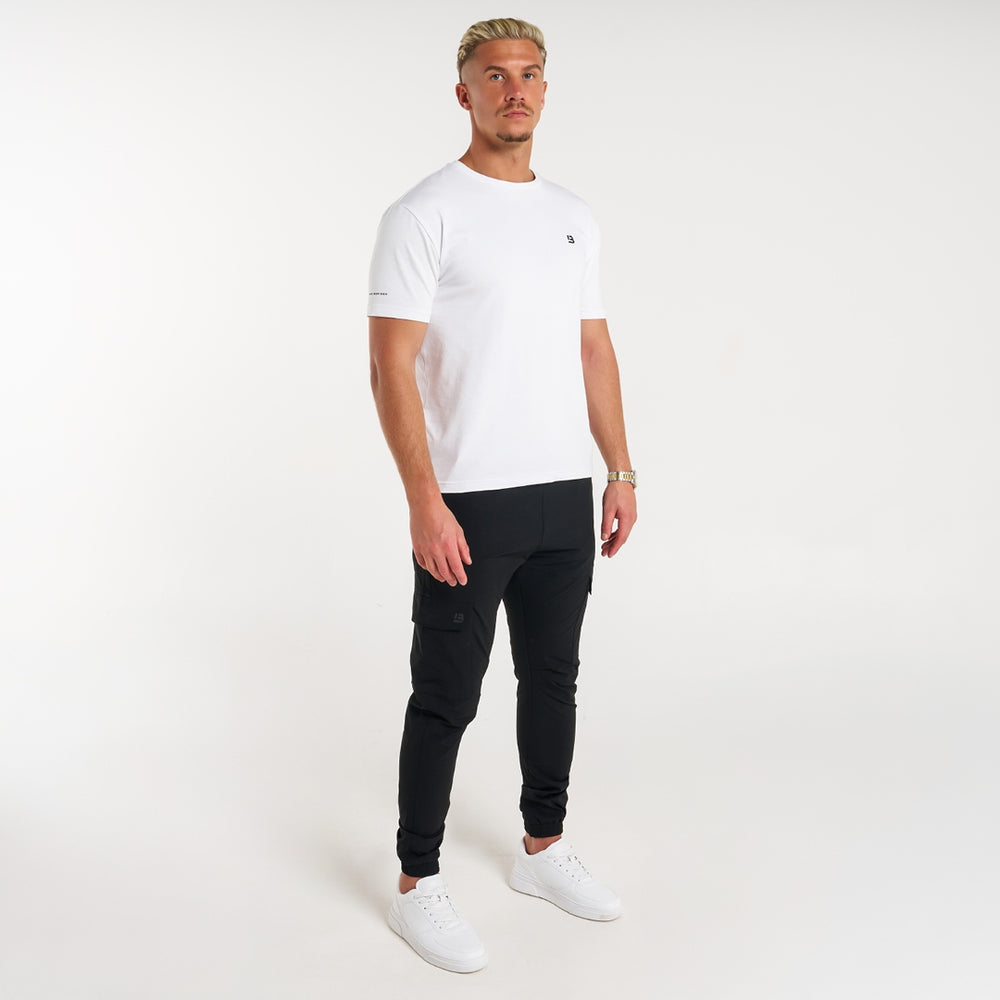 Rivero Tech Cargo Pants in black showing the regular fit