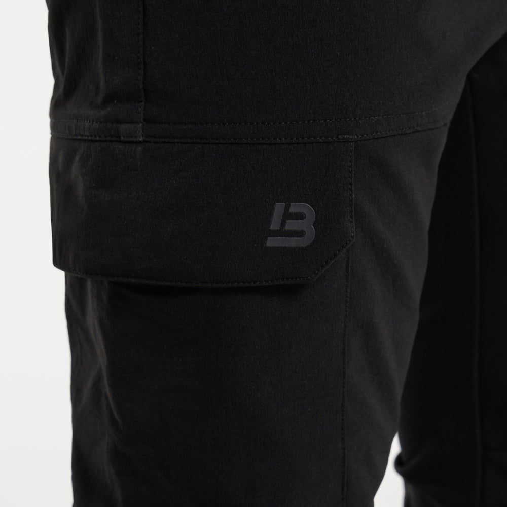 Close up of multiple utility pockets on the Rivero Tech Cargo Pants in black