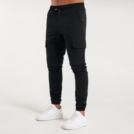 Rivero Tech Cargo Pants in black with stretch ankle cuffs