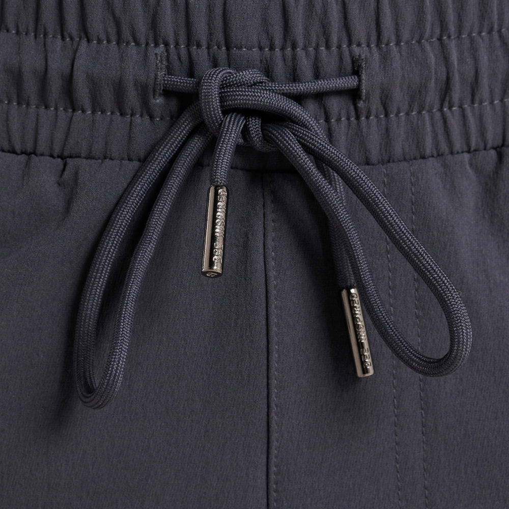 Rivero Tech Cargo Pants in charcoal, focusing on multiple utility pockets
