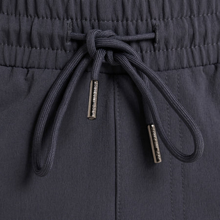 Rivero Tech Cargo Pants in charcoal, focusing on multiple utility pockets