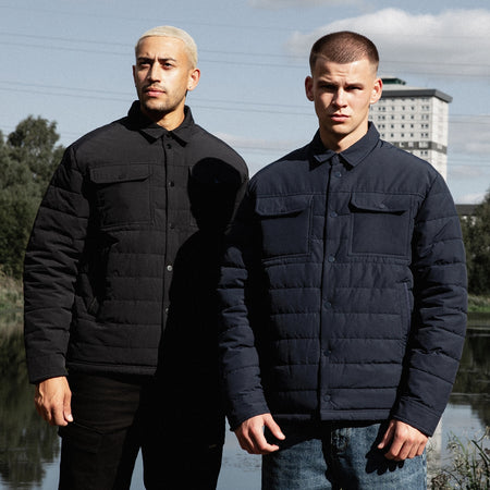 Siegrist Jacket in black, focusing on a snap fastening front