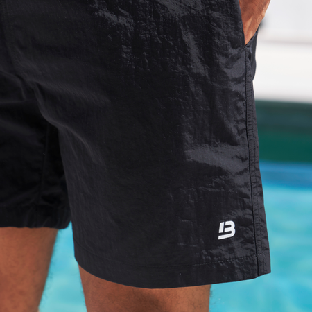 Bee Inspired Simms Swim Shorts in Black, lightweight swim shorts with a quick-dry, summer-ready fit, styled shot