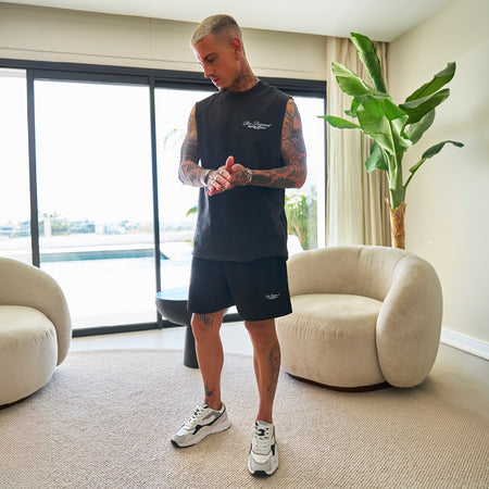 Bee Inspired Team Vest in Faded Black, heavyweight cotton vest with raw armhole detailing, styled shot