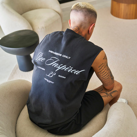 Bee Inspired Team Vest in Faded Black, heavyweight cotton vest with raw armhole detailing, close-up