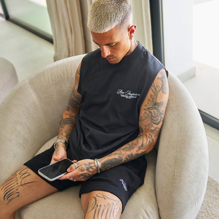 Bee Inspired Team Vest in Faded Black, heavyweight cotton vest with raw armhole detailing, front view