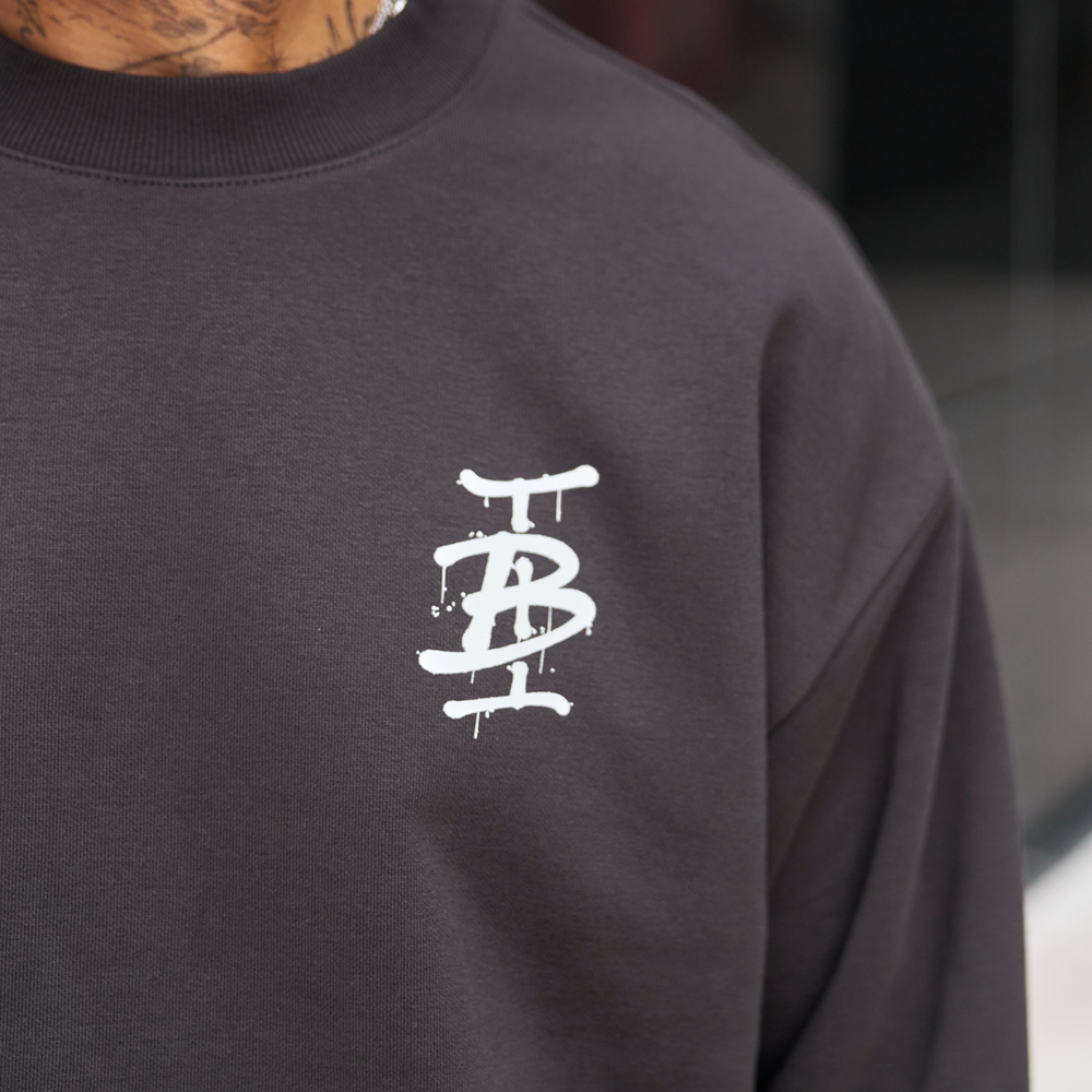 Bee Inspired Tonali Crew in Coal, close-up of graffiti-style chest graphic detail