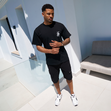 Bee Inspired Tonali Oversized T-Shirt in Black/Aqua, oversized tee with a graffiti-style BI monogram print, styled shot