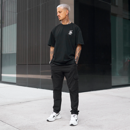 Bee Inspired Tonali Oversized T-Shirt in Black/Red, oversized tee with a graffiti-style BI monogram print, close-up