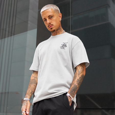 Bee Inspired Tonali Oversized T-Shirt in Faded Storm, oversized tee with a graffiti-style BI monogram print, styled shot