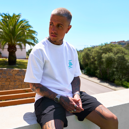 Bee Inspired Tonali Oversized T-Shirt in White/Aqua, oversized tee with a graffiti-style BI monogram print, styled shot
