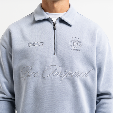 Bee Inspired Zico Zip Polo in Blue, long sleeve collared polo with a quarter-zip neckline, back view